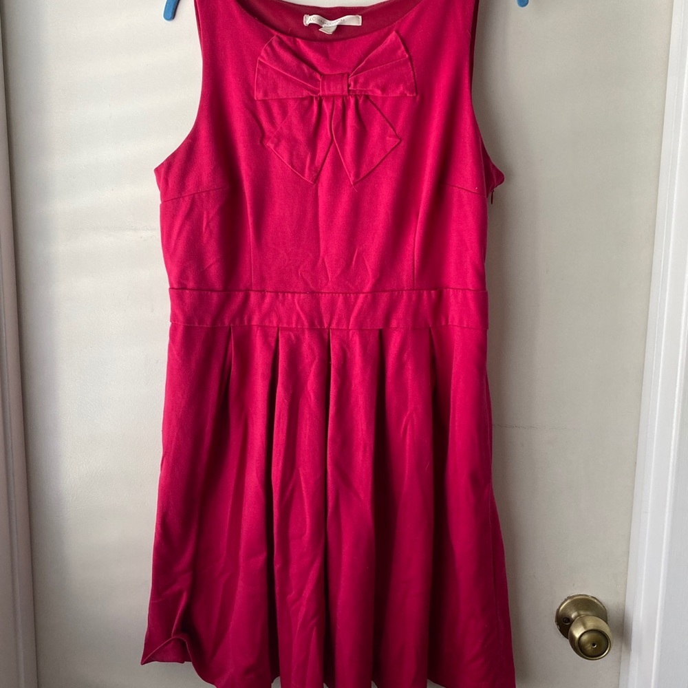 Pink dress with bow detail and pockets
